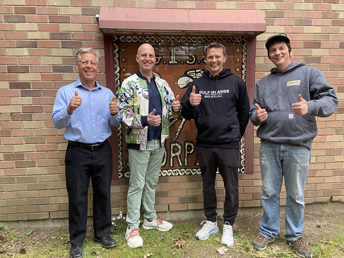 Ethan Wilding with GISS staff Tom Langdon, Jude Shugar, and Ryan Buchanan outside Gulf Islands Secondary School