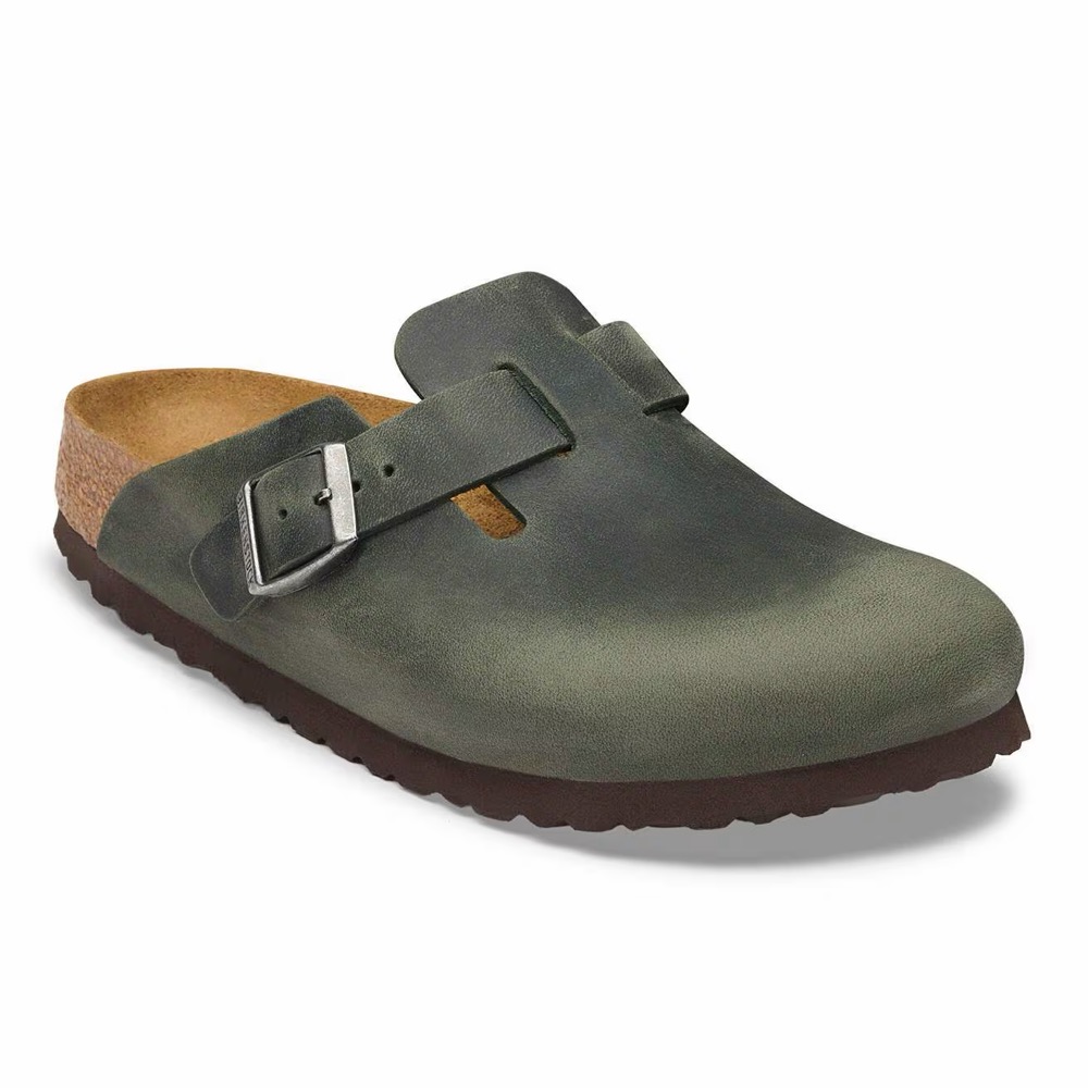 Olive-green oiled-leather closed-toe clog sandal with a buckle strap on a cork footbed