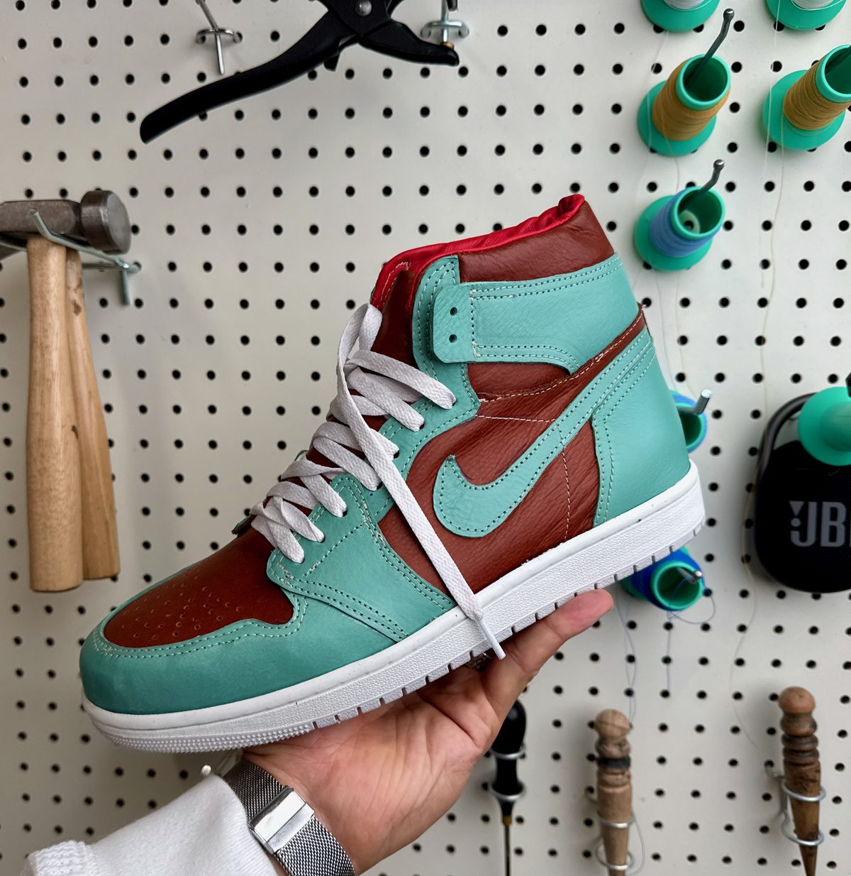 Handmade leather high-top sneaker in teal and brown